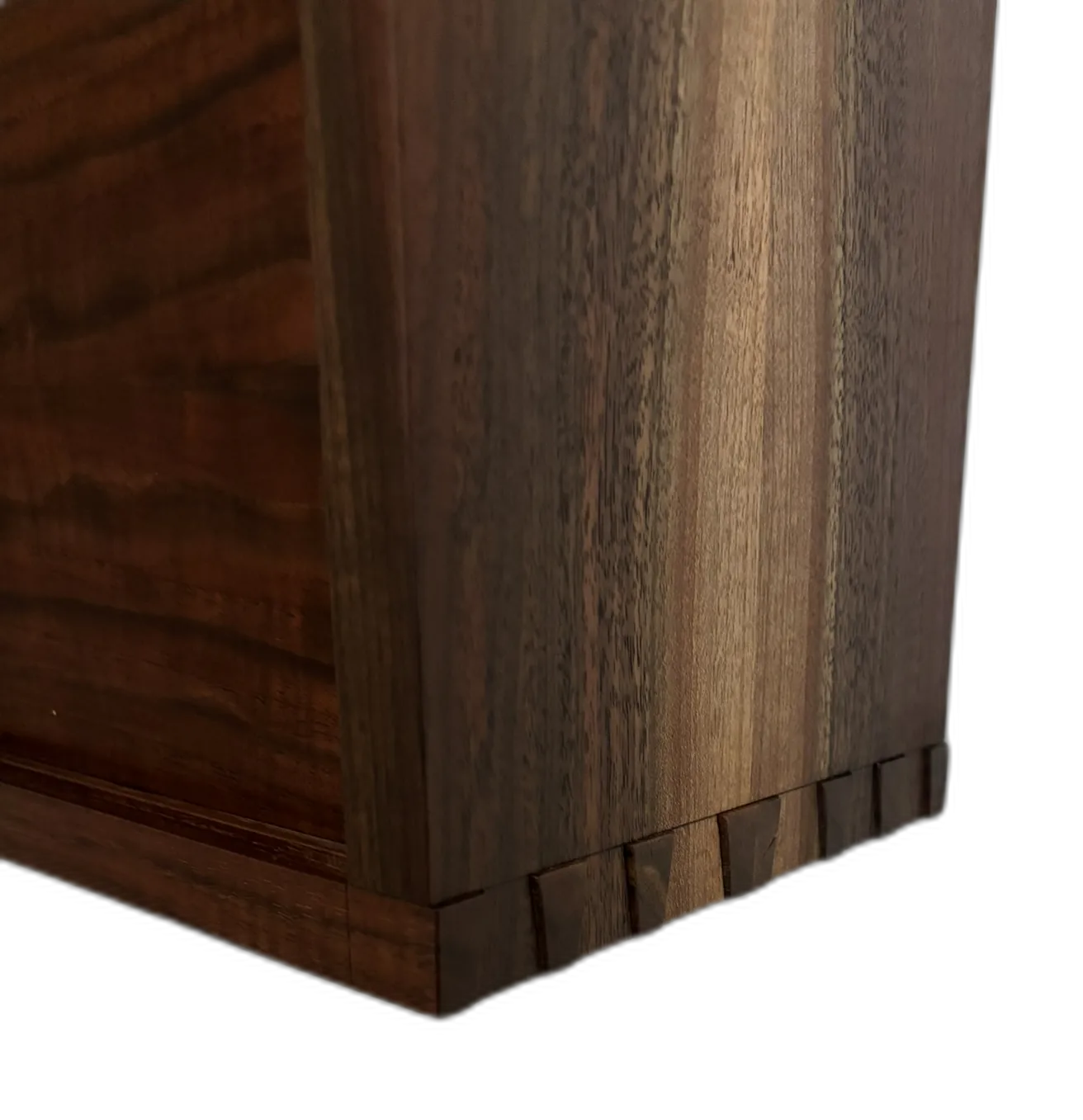 Hand-cut dovetail joinery on a walnut cabinet